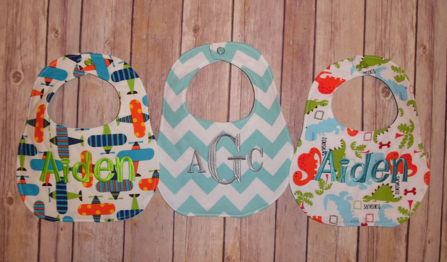 Set of 3 Personalized Bib Set - Perfect Boy Collection - Dinosaurs, Airplanes, Aqua Chevron