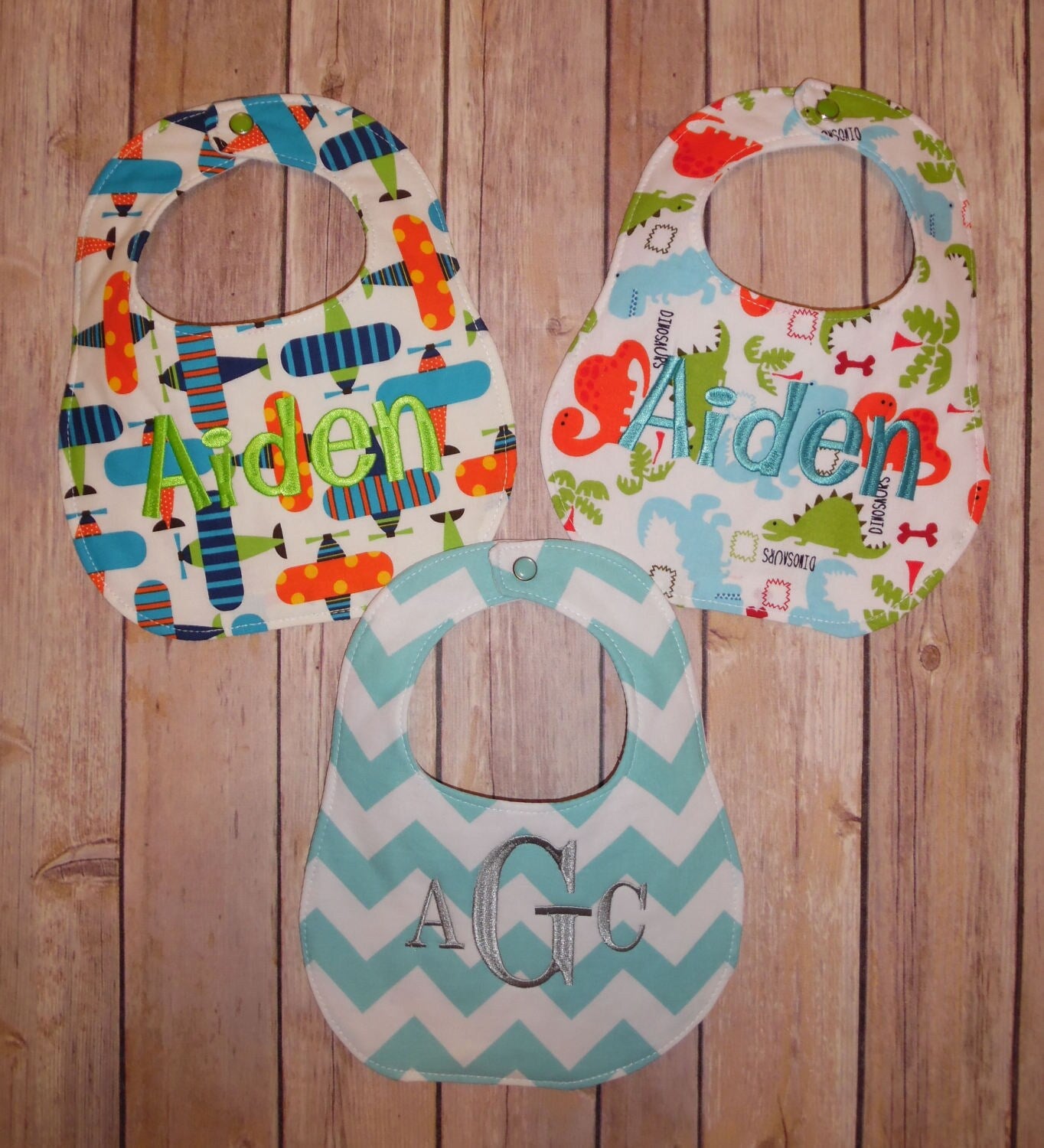 Set of 3 Personalized Bib Set - Perfect Boy Collection - Dinosaurs, Airplanes, Aqua Chevron