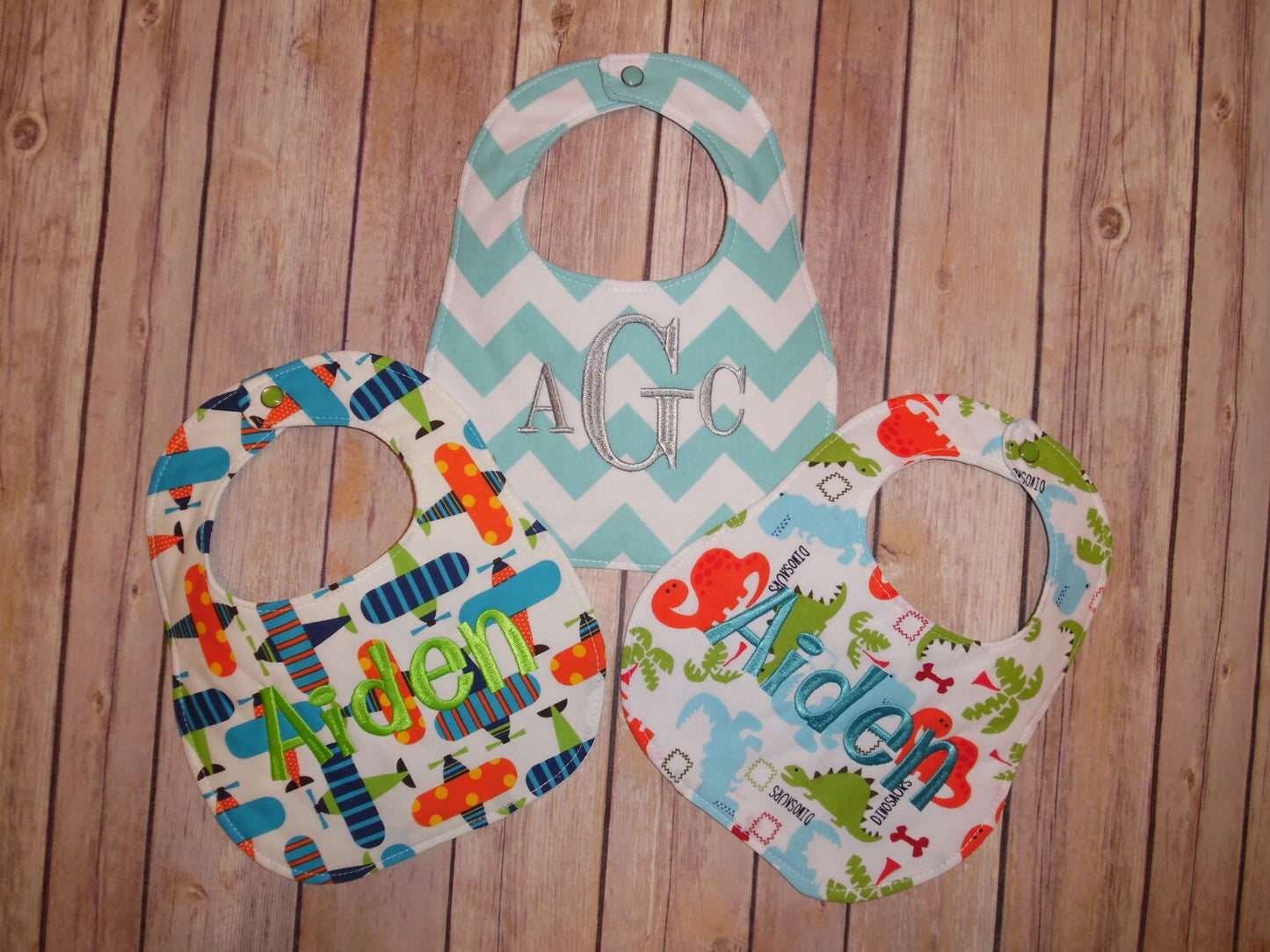 Set of 3 Personalized Bib Set - Perfect Boy Collection - Dinosaurs, Airplanes, Aqua Chevron